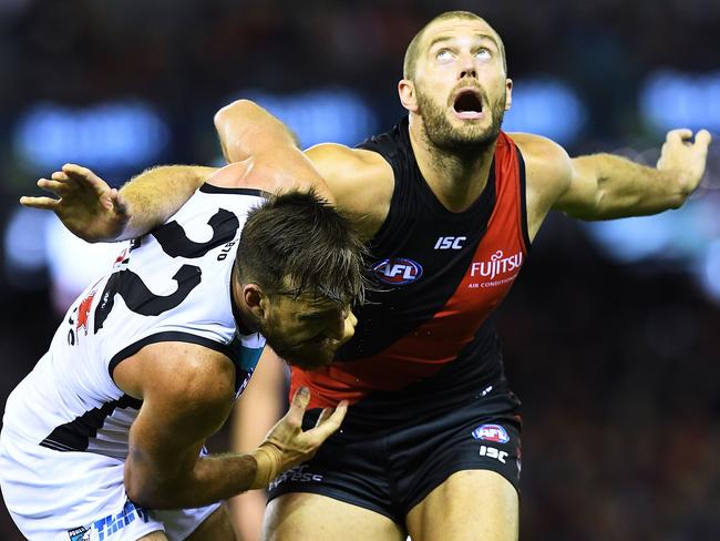 Charlie Dixon of Port Adelaide and Tom Bellchambers of the Bombers.