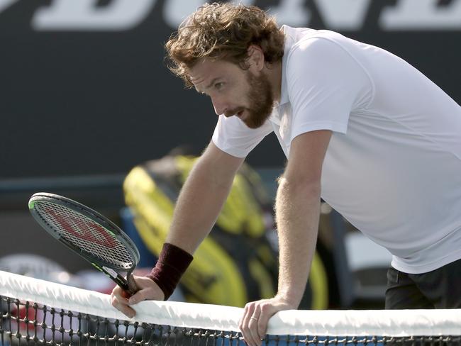 Has anyone got a spared pair of Adidas for Ernests Gulbis? Picture: AP/Dita Alangkara