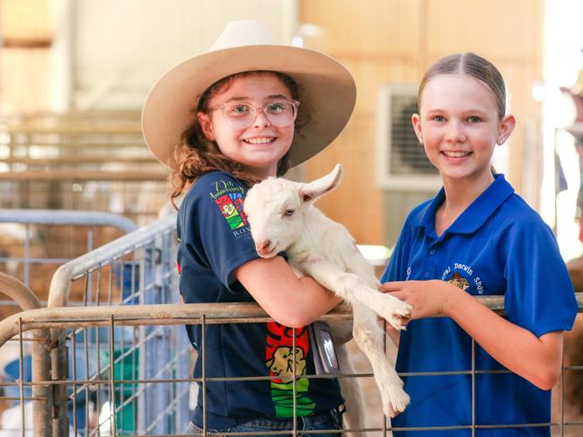 Charlotte Cabot, 11, and Charli Hanus, 11, enjoying day two of the Royal Darwin Show. Picture: Glenn Campbell