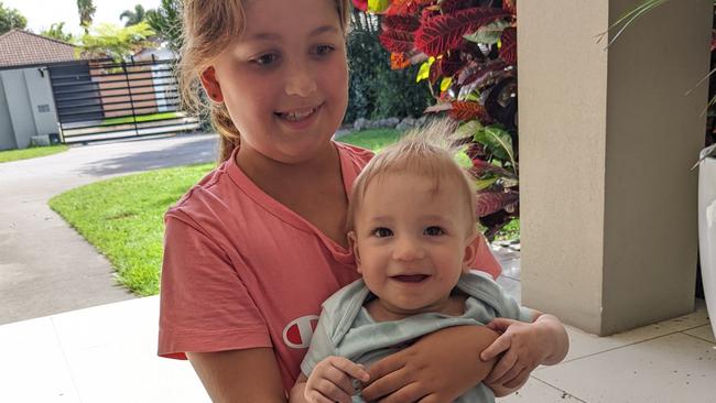 Maxim plays with his 10-year-old cousin Sofia at home in Bundall on the Gold Coast. Picture: Keith Woods