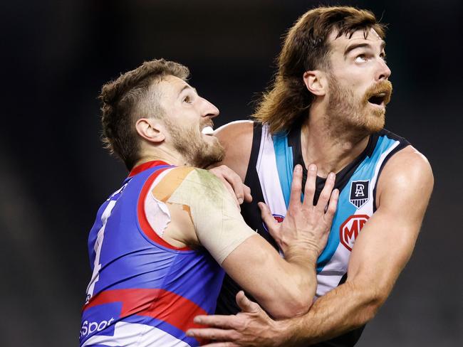 MELBOURNE, AUSTRALIA - AUGUST 20: Marcus Bontempelli of the Bulldogs and Scott Lycett of the Power compete in a ruck contest during the 2021 AFL Round 23 match between the Western Bulldogs and the Port Adelaide Power at Marvel Stadium on August 20, 2021 in Melbourne, Australia. (Photo by Michael Willson/AFL Photos via Getty Images)