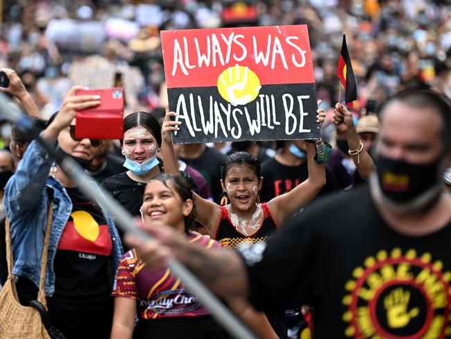 BRISBANE, AUSTRALIA - NewsWire Photos - JANUARY 26, 2022.People take part in an Invasion Day protest in central Brisbane on Australia Day. Picture: NCA NewsWire / Dan Peled