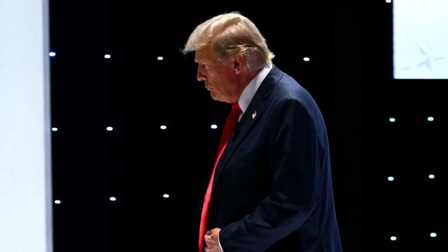 Donald Trump leaves the stage during a commercial break. Picture: AFP.