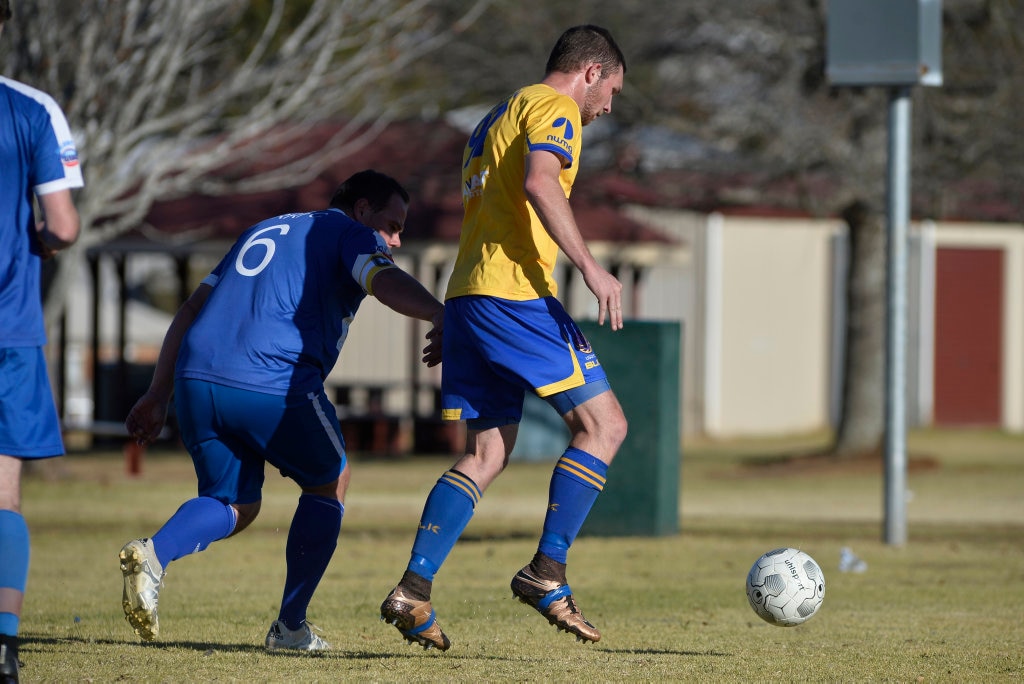 Troy Stubbs (left) of Rockville and Aaron Wieden of USQ FC in Toowoomba Football League Premier Men round 14 at Captain Cook Reserve Des McGovern oval, Sunday, June 24, 2018. Picture: Kevin Farmer