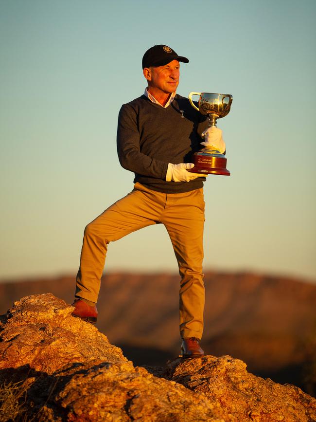 Jimmy Cassidy surveys Alice Springs with the Melbourne Cup. Picture: Mark Stewart