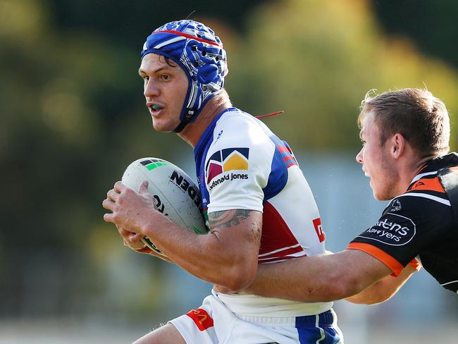 Kalyn Ponga of the Knights is tackled by Billy Walters of the Tigers during the Round 2 NRL match between the Wests Tigers and the Newcastle Knights a Leichhardt Oval in Sydney, Wednesday, May 1, 2019. (AAP Image/Brendon Thorne) NO ARCHIVING, EDITORIAL USE ONLY