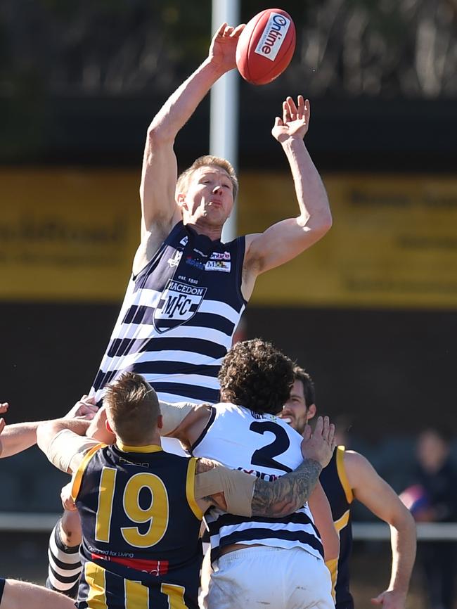 Tom Waters jumps high for Macedon.