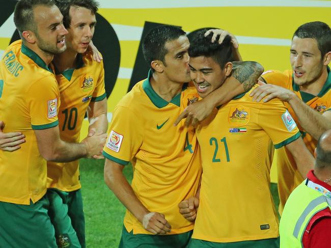 MELBOURNE, AUSTRALIA - JANUARY 09: Massimo Luongo of the Socceroos is congratulated by Tim Cahill and his teammates after scoring a goal during the 2015 Asian Cup match between the Australian Socceroos and Kuwait at AAMI Park on January 9, 2015 in Melbourne, Australia. (Photo by Scott Barbour/Getty Images)