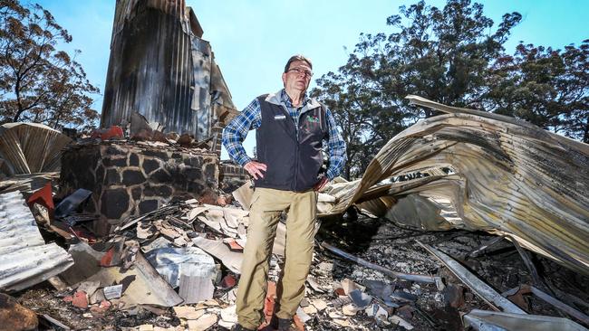 “When I woke up, it was gone.” Steve Noakes in the wreckage of Binna Burra Lodge. Picture: Nigel Hallett