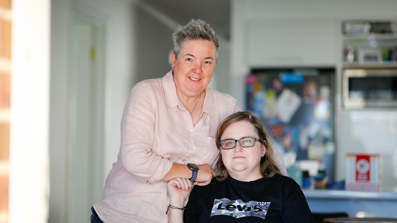 Megan and Julie (glasses) Etheridge left their husbands and found each other while working for rival car rental companies at Alice Springs Airport. The couple have moved back to Adelaide. Picture Matt Turner.