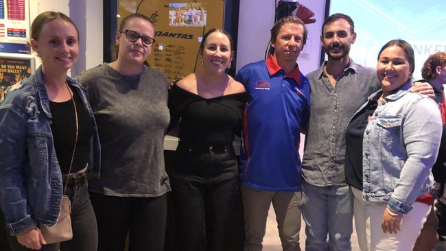 Hayley Richmond (third from left) and husband Luke Richmond (second from right) with raffle organisers Amy Mill, Laura Jonassen, Aaron Harmsworth and Demi Fraser.