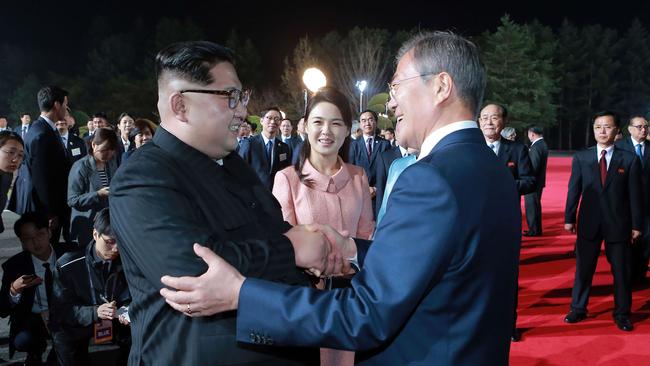 North Korea's leader Kim Jong-un and South Korea's President Moon Jae-in bidding farewell during a closing ceremony of the inter-Korean summit. Picture: AFP Photo/KCNA via KNS