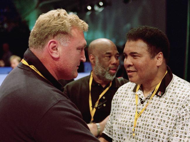 Joe Bugner greets Muhammad Ali during the Sydney Olympic Games in 2000. Picture: Getty