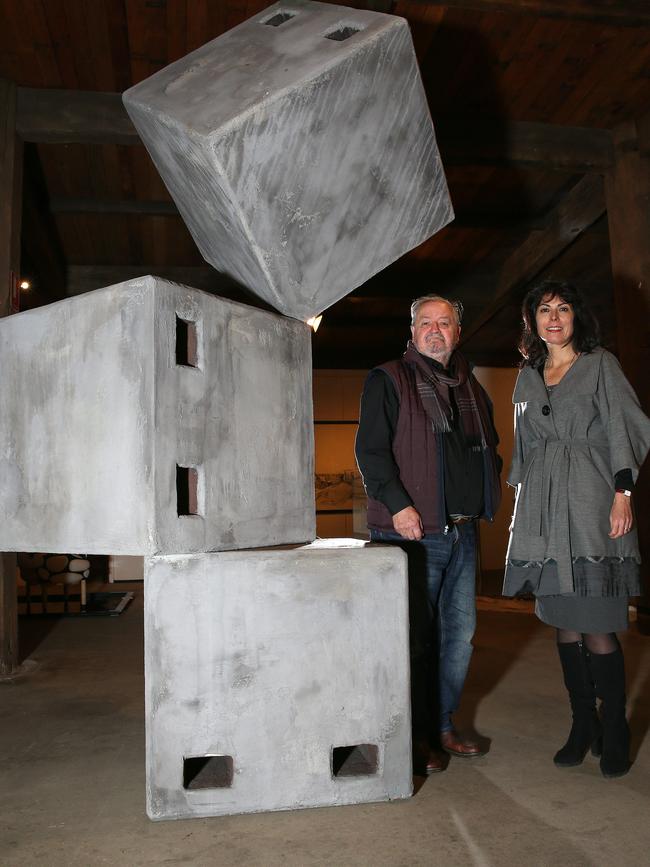 Montsalvat executive director Jacqueline Ogeil with architect Geoffrey Falk beside one of the many pieces of art on display at the Eltham arts precinct. Picture: George Salpigtidis