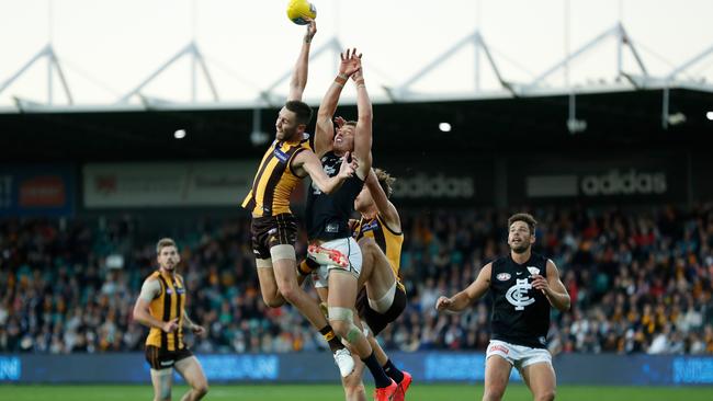 Jack Gunston of the Hawks and Patrick Cripps of the Blues compete for the ball during the 2019 AFL round 06 match in Launceston. Picture: MICHAEL WILLSON/AFL PHOTOS