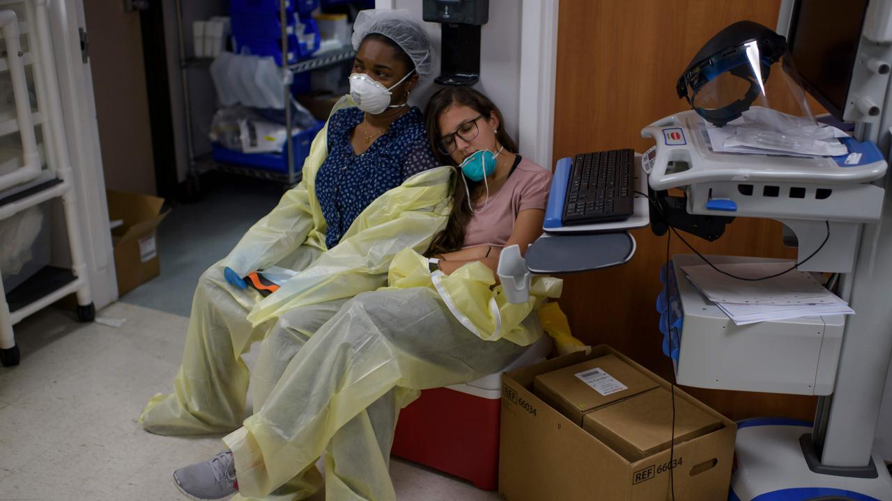 Exhausted healthcare workers at Houston’s United Memorial Medical Centre, overwhelmed with exploding COVID-19 cases. Picture: Mark Felix/AFP