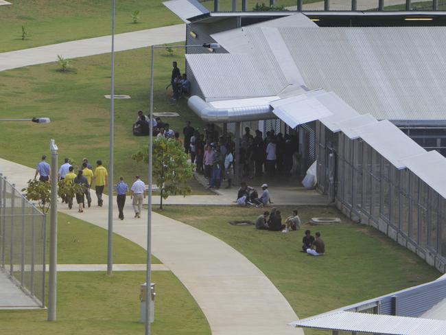 NEWS - A group arrive at the North West Point detention centre, including Police and Interpreters, to interview the survivors of Thursday's crash.