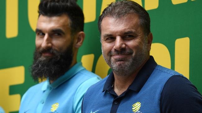 A smiling Ange Postecoglou with Socceroos captain Mile Jedinak at a celebration event in Sydney. Picture: AAP