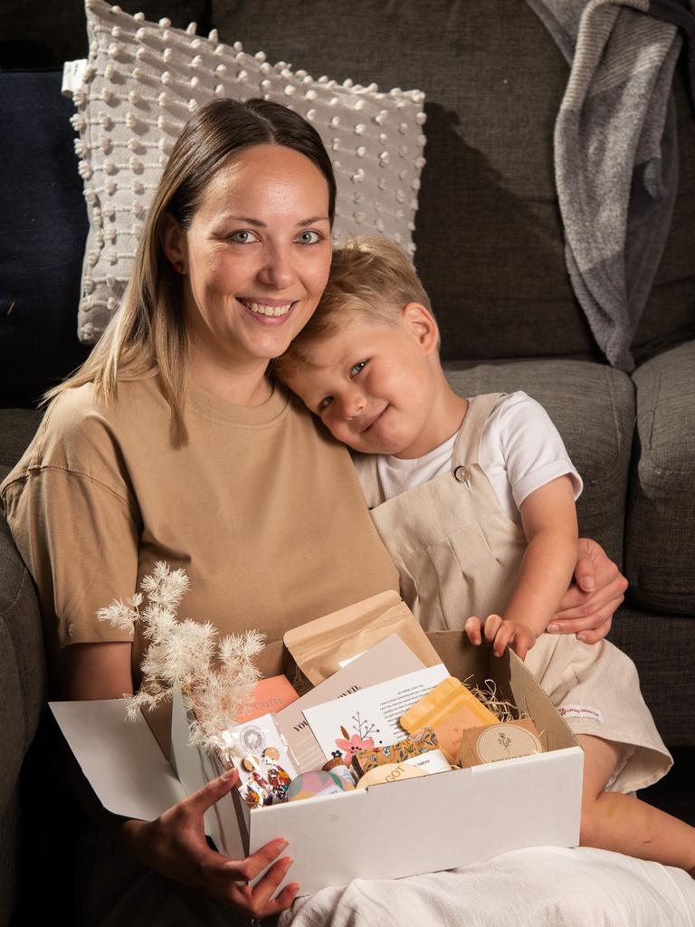 Emma Macreadie, with son Kyan, 3, has been preparing and handing out self care hampers to mothers who are doing it tough. Picture: Tony Gough