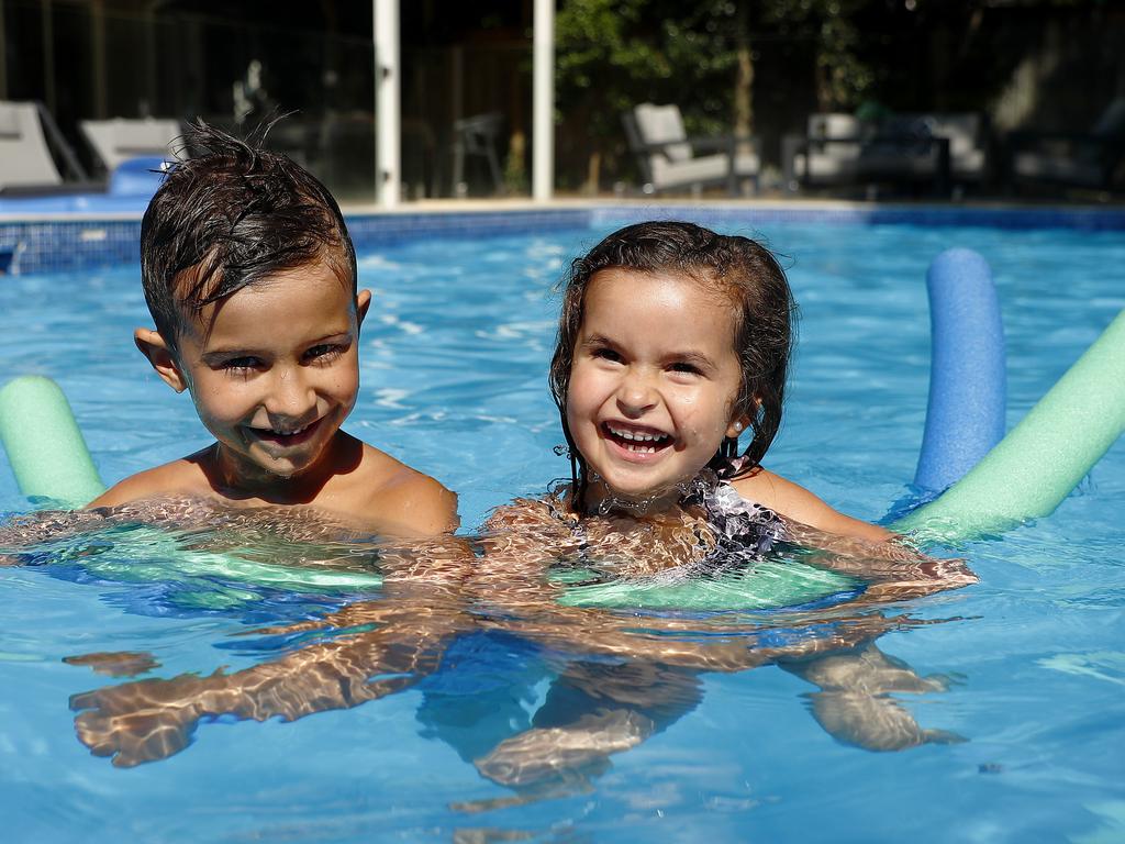 Jackson and Brooklyn Booth play in their backyard pool. Picture: Sam Ruttyn