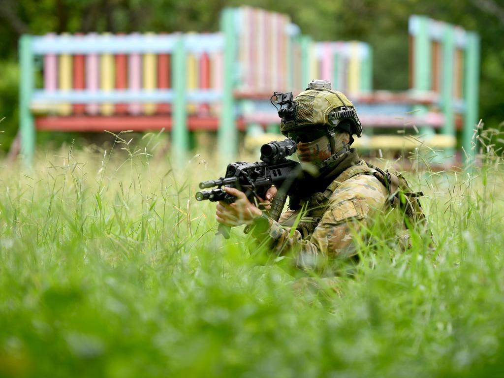 Soldiers from 3RAR perform urban training at the former Stuart State School. Picture: Evan Morgan