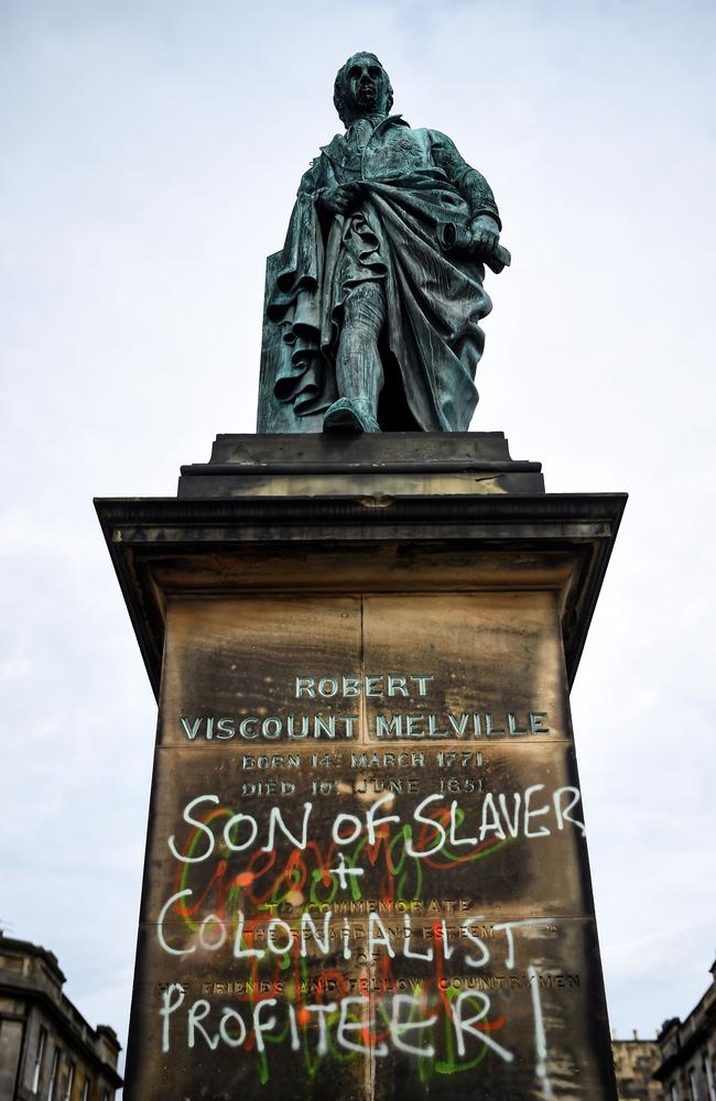 Graffiti covers a statue of Robert Dundas, 2nd Viscount Melville, on Melville Street in Edinburgh. Picture: Andy Buchanan/AFP)