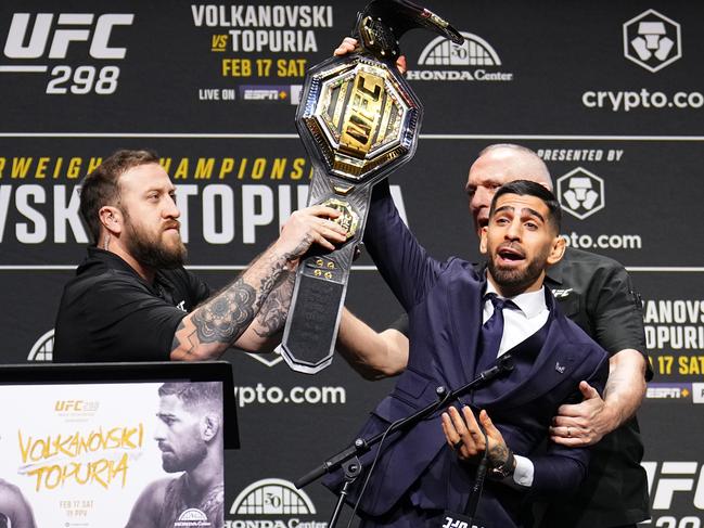 Ilia Topuria made a desperate attempt to steal Volkanovski’s belt during their pre-fight press conference. Picture: Chris Unger/Zuffa LLC via Getty Images