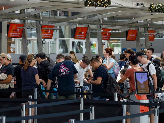 WEEKEND TELEGRAPHS. CHECK WITH PIC EDITOR JEFF DARMANIN BEFORE USE. People queue for check in at the Jetstar counter at Sydney Domestic Airport, on what is historically one of the busiest days of the year at SydneyÃs airports. Pic shows . Friday 15/12/2023. Picture by Max Mason-Hubers