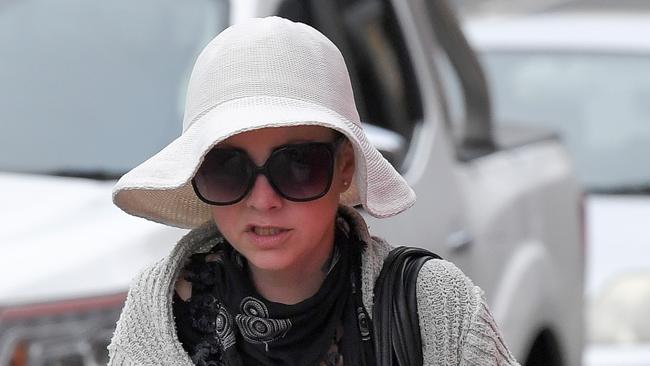 Gemma Purcell tried to hide her identity with large sunglasses and a hat as she arrived at Wollongong Local Court on Tuesday. Picture: Simon Bullard