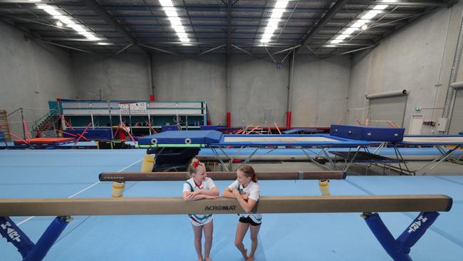 Varsity Lakes Trampoline and Gymnastics Club have been through hell these past six months. Like the phoenix rising from the ashes they will reopen for training on July 13 ironically in a stronger position after having managed to attracted elite coaches and gymnasts to the club from another one. Olive Davis 9 and Lyla Proctor 10 training at the club. Picture Glenn Hampson