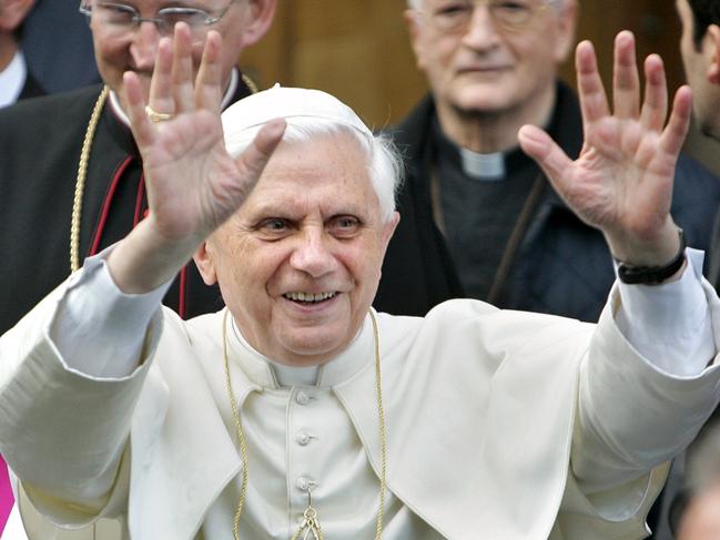 Pope Benedict XVI greets the crowd in Rome, Apr 21 2005. The Pontiff, former Cardinal Joseph Ratzinger of /Germany, exited the Vatican City for a visit to his former home. (AP picJasper/Juinen) religion catholic waving