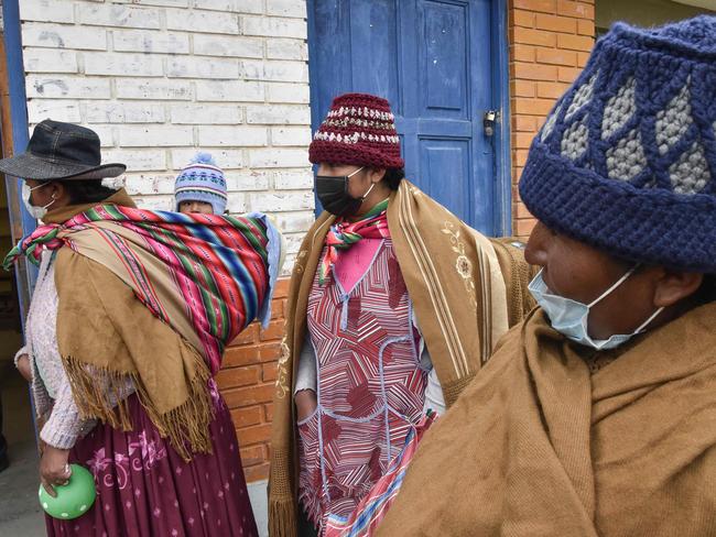 Indigenous women leave their children at kinder at a Machacamarca highlands town in Bolivia. Picture: AFP