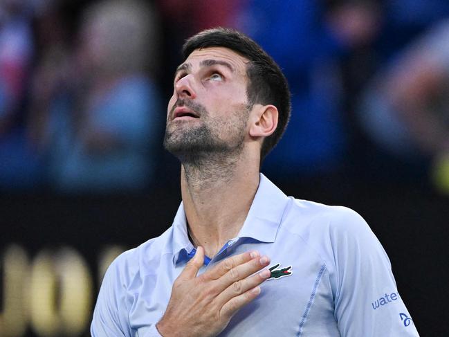 Serbia's Novak Djokovic celebrates after victory against USA's Taylor Fritz during their men's singles quarter-final match on day 10 of the Australian Open tennis tournament in Melbourne on January 23, 2024. (Photo by WILLIAM WEST / AFP) / -- IMAGE RESTRICTED TO EDITORIAL USE - STRICTLY NO COMMERCIAL USE --