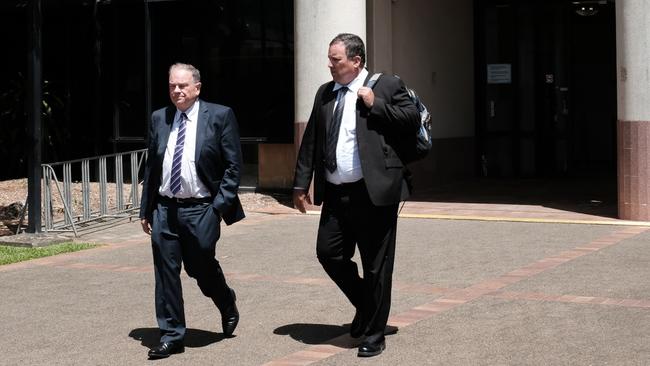 Detective Senior Constable Byron Worth (right) leaves the Cairns courthouse with his barrister at the conclusion of giving evidence in the Coronial Inquest into the disappearance of Ms Bernard. April 4, 2022.