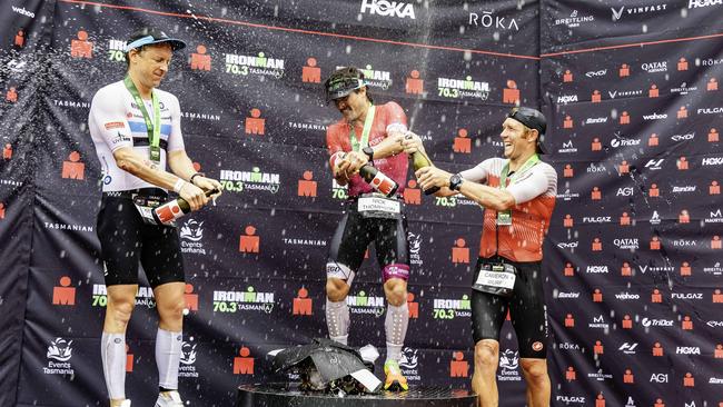Winners on the podium at the Ironman 70.3 Tasmania in Hobart on Sunday 4th February 2024. L-R Mitch Kibby 2nd, Nick Thompson 1st, and Cam Wurf third. Picture: Linda Higginson