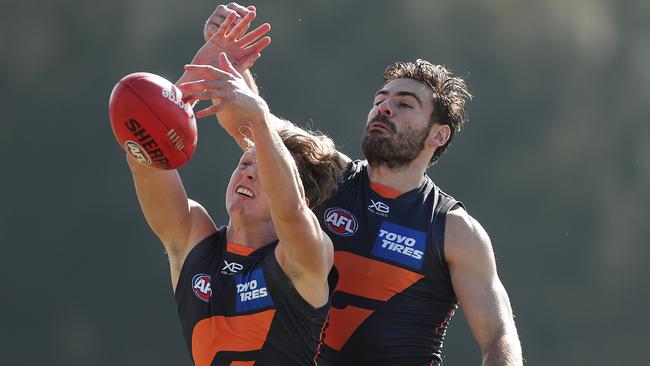 Stephen Coniglio spoils teammate Lachie Whitfield at Giants training. Picture: Mark Metcalfe/Getty Images