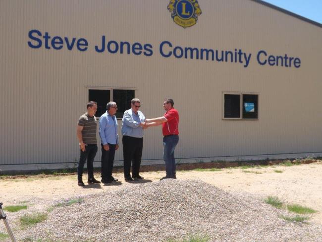 From left: Jaedan Edmonstone, Mark Lavender, Bruce Horrocks of Withcott Helidon Lions Club and Josh Holopainen of R & F Steel Buildings hands over the keys after the Steve Jones Community Centre gets to lock-up.