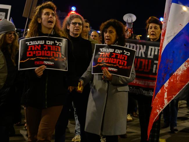 TEL AVIV, ISRAEL - DECEMBER 15: Protesters march through the streets after demonstrating outside the Israel Defense Force headquarters on December 15, 2023 in Tel Aviv, Israel. Earlier today, the IDF said its forces accidentally killed three hostages being held in Gaza when it mistakenly identified them as potential threats. Yotam Haim, Samer Talalka, Alon Shamriz were kidnapped from southern Israel on Oct. 7 by Hamas militants and taken back to the Gaza Strip. Israel launched an air and ground campaign in Gaza soon thereafter in an effort to defeat Hamas. In November, a weeklong ceasefire allowed for the negotiated release of some hostages, but more than 100 remain in captivity. (Photo by Alexi J. Rosenfeld/Getty Images)