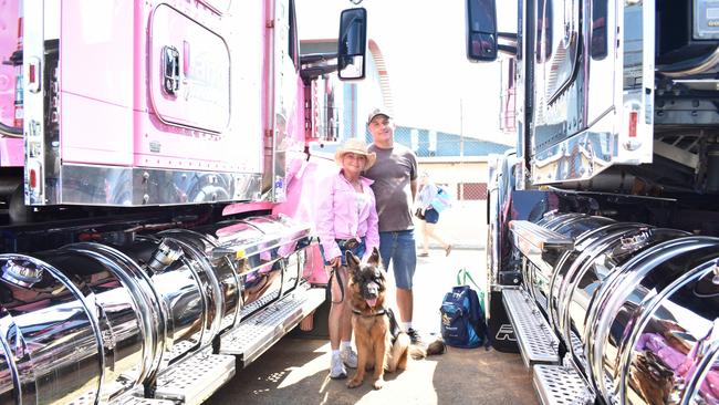 Tony, Same, and Isla seek shade between two trucks at the 2023 Lights On The Hill memorial on Saturday, September 30.