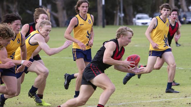 Rostrevor’s Kade Maddigan streams towards goal during his side’s round two clash against Scotch. Picture: Emma Brasier