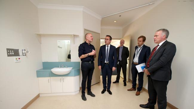 ECH CEO David Panter with Premier Steven Marshall and Health Minister Stephen Wade touring the ECH property that will reopen to take an overflow of cases as other Adelaide hospitals begin to take more virus cases. Picture: AAP / Kelly Barnes