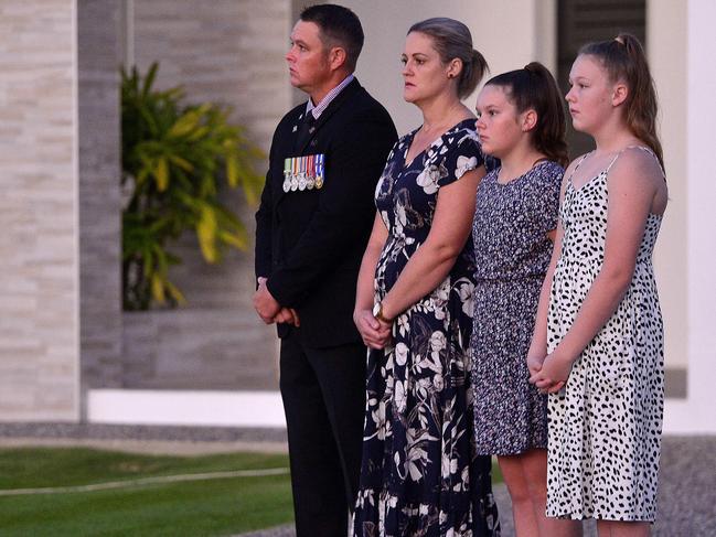 Jai and Kylie Ryan with Ika, 13 and Emily, 14. Residents of Hamptongrove Boulevard in Mount Louisa took to their street to commemorate Anzac Day 2020, amid the coronavirus pandemic and subsequent social distancing regulations. PICTURE: MATT TAYLOR.