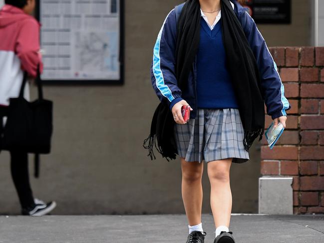 A student is seen at Strathfield Train Station in Sydney, Friday, May 22, 2020. Students return to classroom learning in NSW, Queensland and Victoria next week amid an easing of coronavirus restrictions. (AAP Image/Bianca De Marchi) NO ARCHIVING