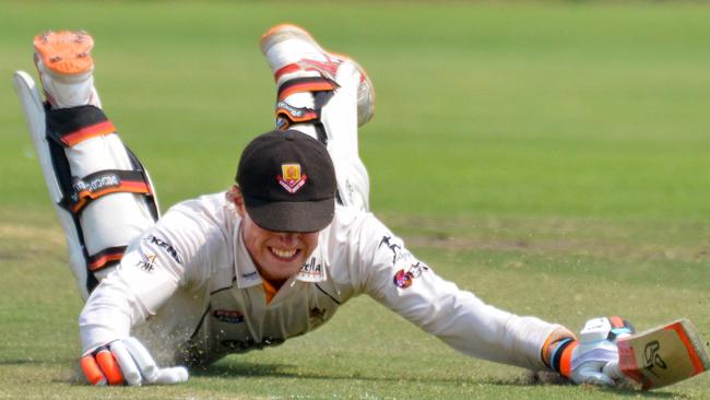 Kensington batsman Sam Rahaley dives back into the crease during a clash with Northern Districts in the 2019/2020 Premier Cricket season. Picture: Brenton Edwards