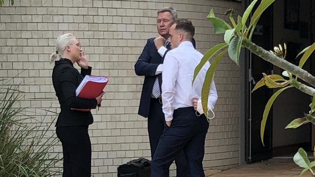 Zain Papa (far right) talks with lawyers after his sentence was handed down before Tweed Heads Local Court.