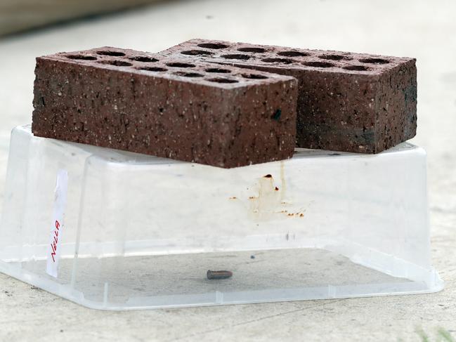 A bullet sits under a forensic container at the scene of a fatal shooting in Donnybrook. Picture: David Crosling