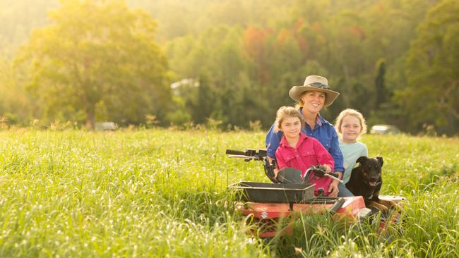 Bianca on the quad bike with her daughters Siena and Scarlett. Picture: Clayton Lloyd