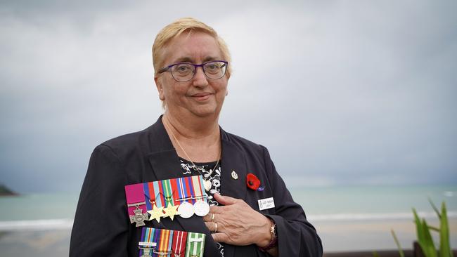 Judith Sheean, the niece of the late Teddy Sheean, who received a posthumous Victoria Cross for his heroic actions 78 years after dying in battle during World War II. Pictured at the Half Tide Beach Dawn Service, Anzac Day 2021, wearing Teddy's medals (top) and her late husband William Sheean's medals. Picture: Heidi Petith