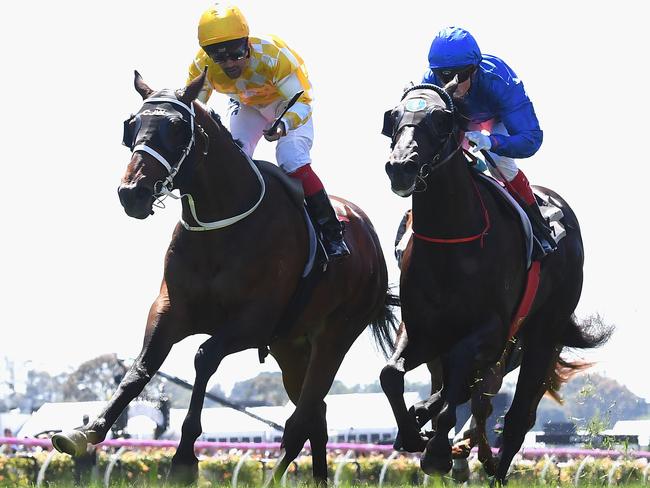 Michael Walker and Comin' Through arrive late to take out the Carbine Club Stakes. Picture: Getty Images