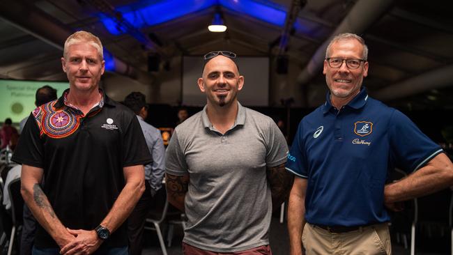 Matthew Simmonds, Richard Hughes and Matthew Peachey celebrates as International Men's Day Lunch at the Darwin Turf Club Pavilion, Darwin. Picture: Pema Tamang Pakhrin